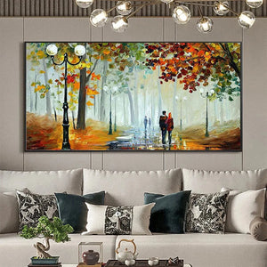Liam O'Connell's Autumn Park Stroll painting shows a couple walking on a wet path with lampposts amid vibrant fall foliage.