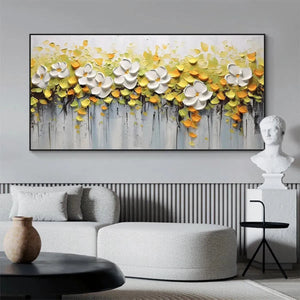 White Magnolias textured floral painting with dimensional white flowers and yellow foliage, in a modern living room setting.