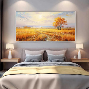 Golden Harvest landscape painting by Isabella Rossi displayed above bed in modern bedroom interior.