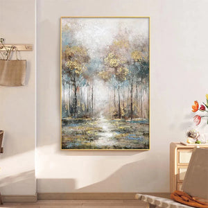 Golden Forest Path vertical wall art by Liam O'Connell. Textured landscape with gold, blue, and grey tones, framed in gold.