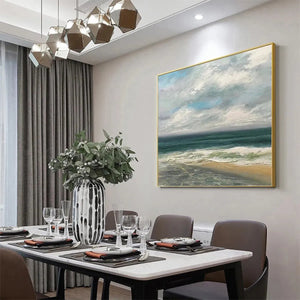 Liam O'Connell square coastal painting in a modern dining room, featuring textured waves and a cloudy sky.