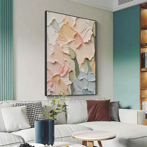 Textured impasto floral painting 'Pastel Petals' in peach, pink, cream, pale blue, displayed in a living room.