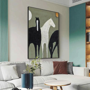 Minimalist painting of three horses, one white and two black, on sage green background, vertical wall art in living room.