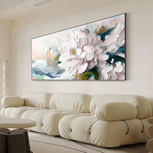 Textured impasto white peony painting above cream sectional sofa, romantic floral wall art.