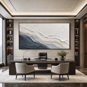 Textured grey and gold abstract landscape painting in a modern office