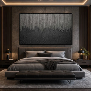 Large textured black and grey abstract wall art above modern bed