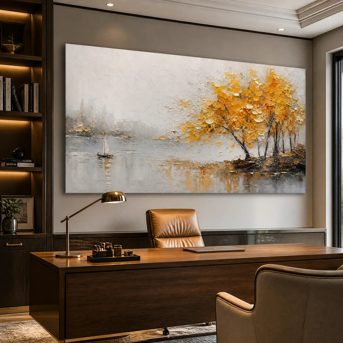 Autumn lake tree wall art with golden impasto trees and sailboat reflections above a modern office desk.