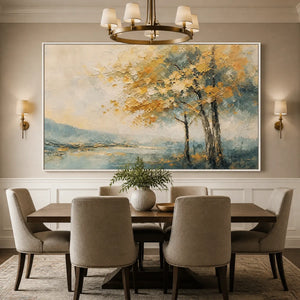 Modern abstract landscape painting in white frame, displayed in a bright dining room.