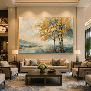 Textured abstract landscape artwork in wood frame, hanging in a luxury hotel lobby.