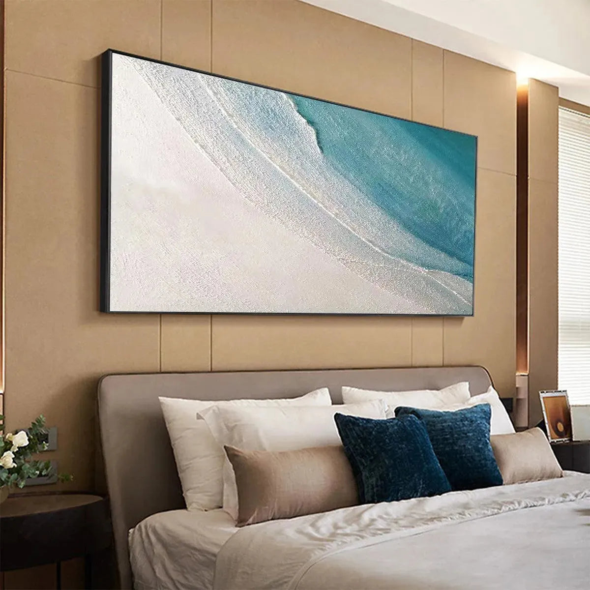 AZURE SHORES abstract beach painting, blue and white textured coastal artwork by Liam O'Connell, framed in a bedroom setting.