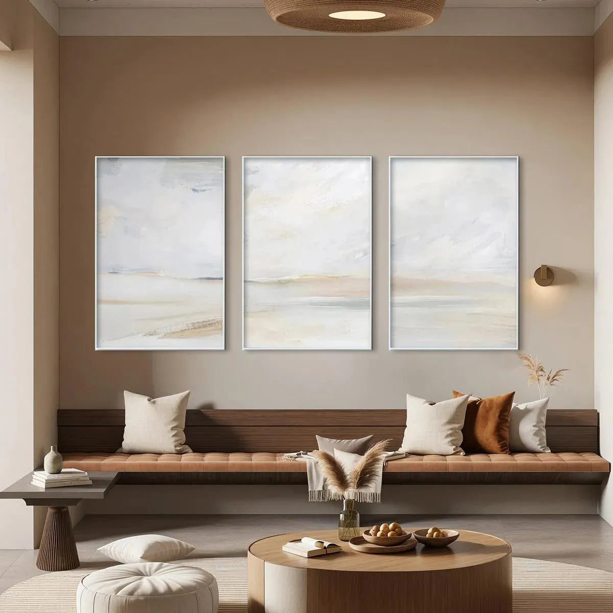 Liam O'Connell Abstract Beach Triptych in a room setting. Minimalist art with neutral tones and gold frames.