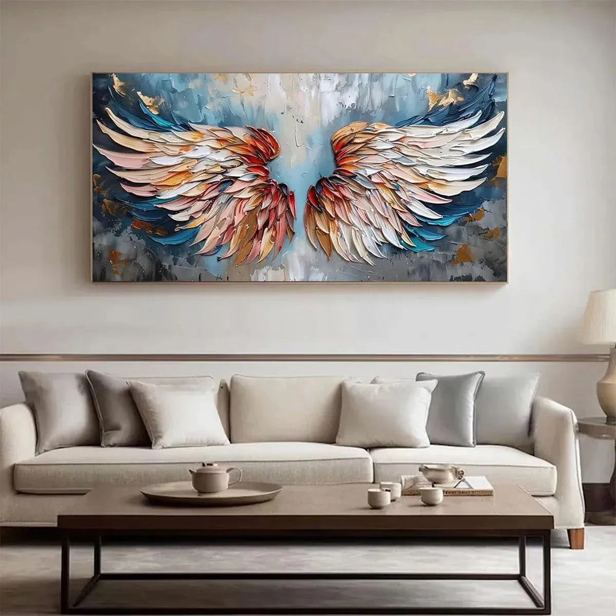 Isabella Rossi's Angel Wings painting, impasto texture, vibrant colors, framed above a sofa. MontCarta art.
