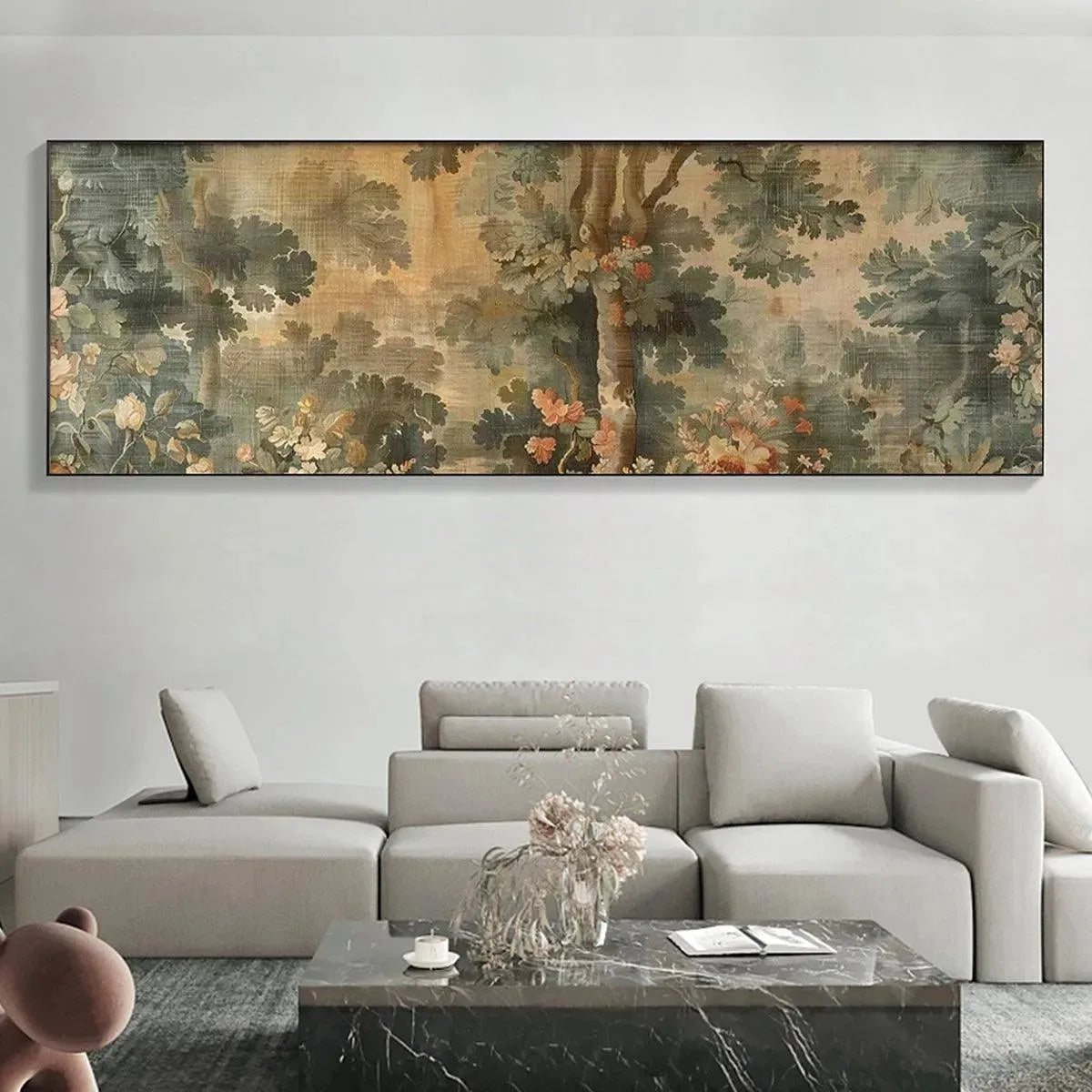 Antique Forest Tapestry by Liam O'Connell: Panoramic sage and gold forest with blush flowers above grey sofa.