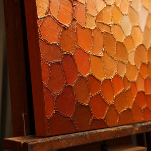 Close-up detail of Ember Scale Field showing hand-painted texture and part of the frame