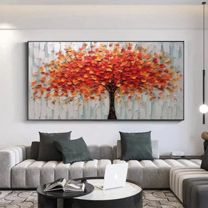 Impasto autumn tree painting with orange-red leaves, displayed above grey sofa in contemporary living room.