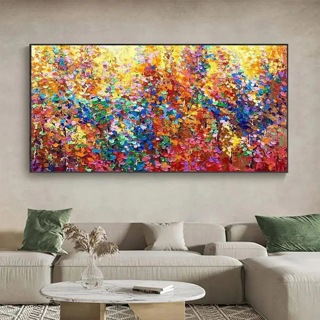 AUTUMN GLOW textured abstract impasto painting with vibrant fall colors displayed above a sofa in a living room.