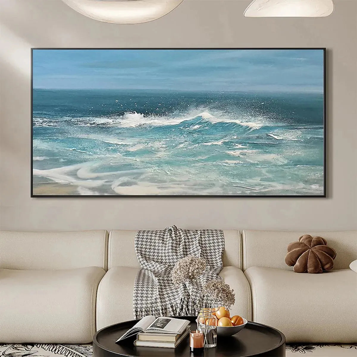 Liam O'Connell's Azure Crests painting: panoramic seascape of a blue wave with white foam above a sofa.