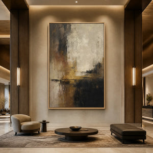 Abstract landscape oil painting with cream, black and gold tones displayed in a luxury hotel lobby.