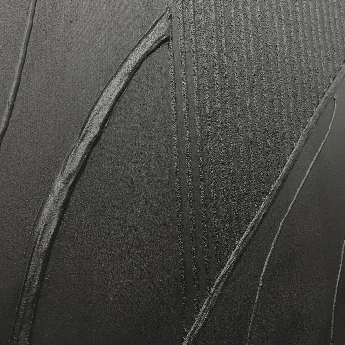 Black Textured Abstract painting by Javier Ramirez with gold frame, minimalist artwork for modern interior