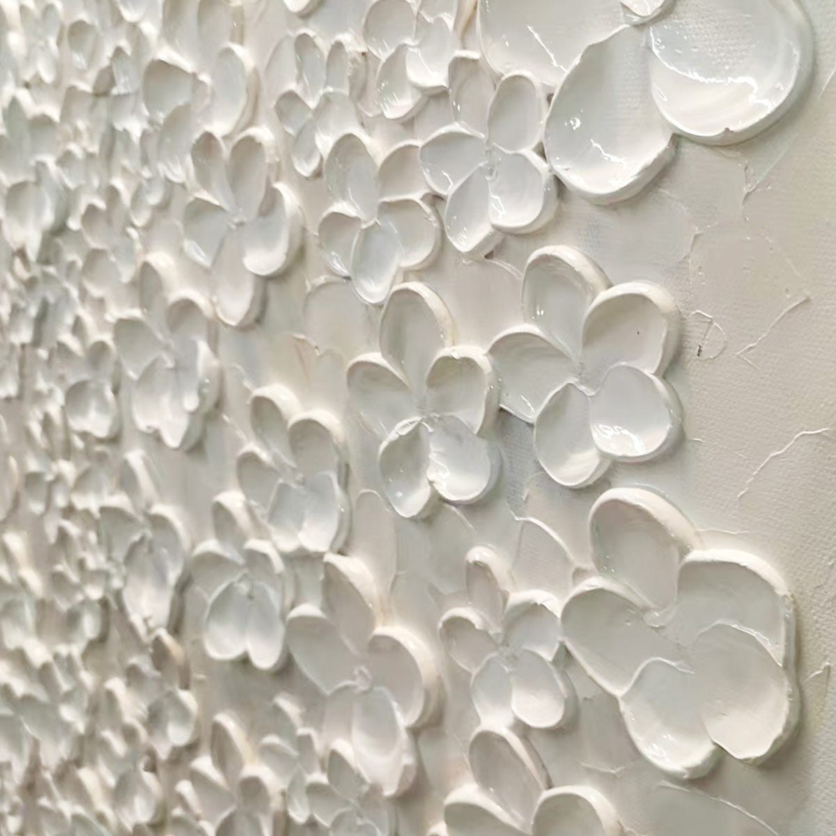 Close-up textured impasto painting of white flowers, showcasing the raised petals and glossy finish on a matte canvas.