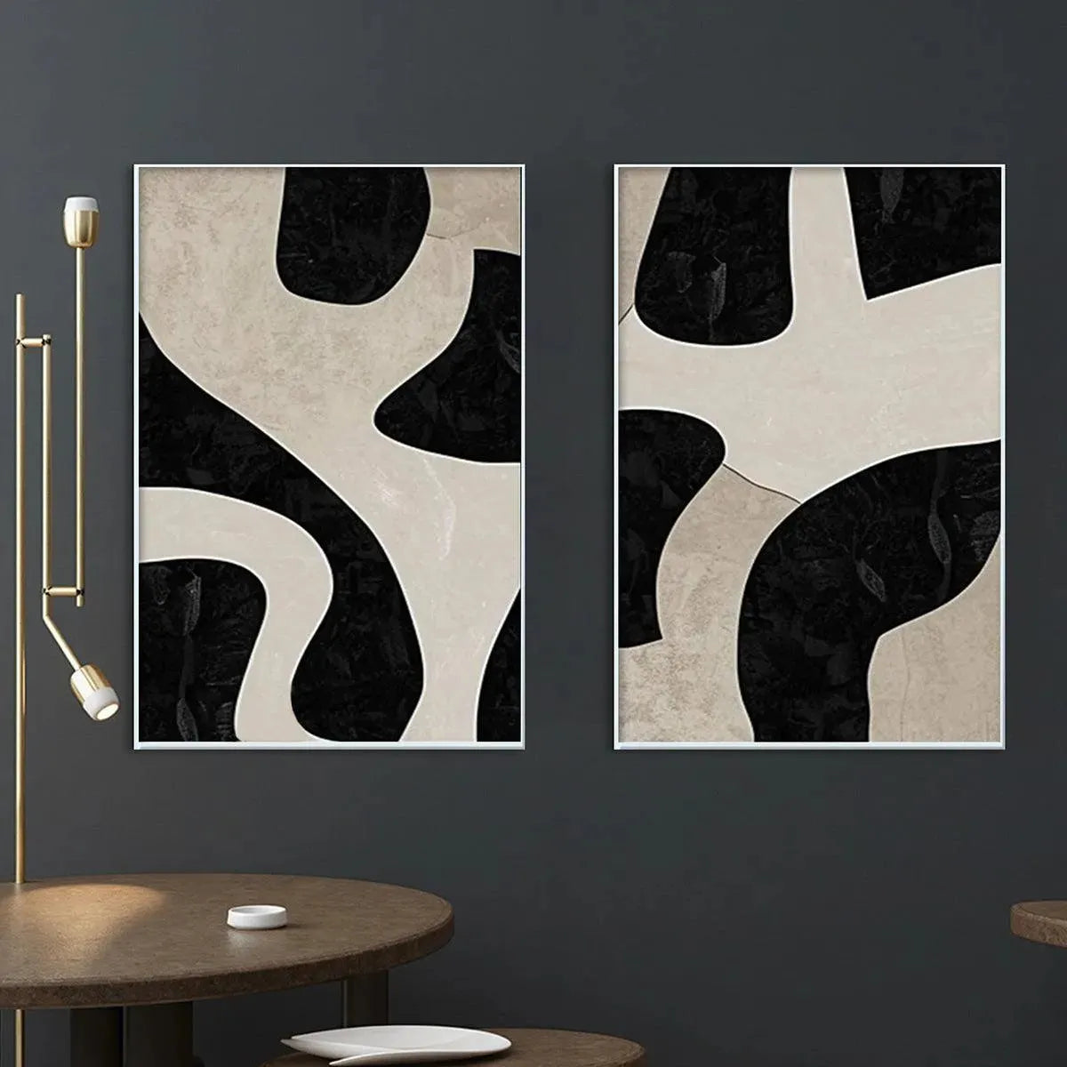 Diptych of two vertical abstract paintings in black and beige with organic shapes, modern wall art.