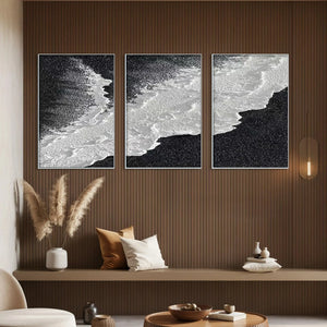 Black & White Ocean Triptych by Liam O'Connell, modern vertical wall art, abstract waves. Coastal decor above neutral bench.