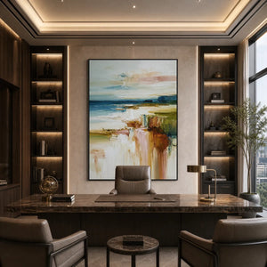 Textured abstract coastal landscape painting in blue, beige and warm earth tones in a modern office