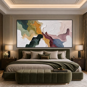 Textured abstract impasto wall art with flowing green, gold, burgundy, blue and white tones above a bed