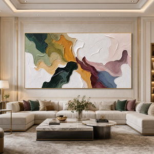 Colorful textured abstract impasto wall art above modern sectional sofa in luxury living room