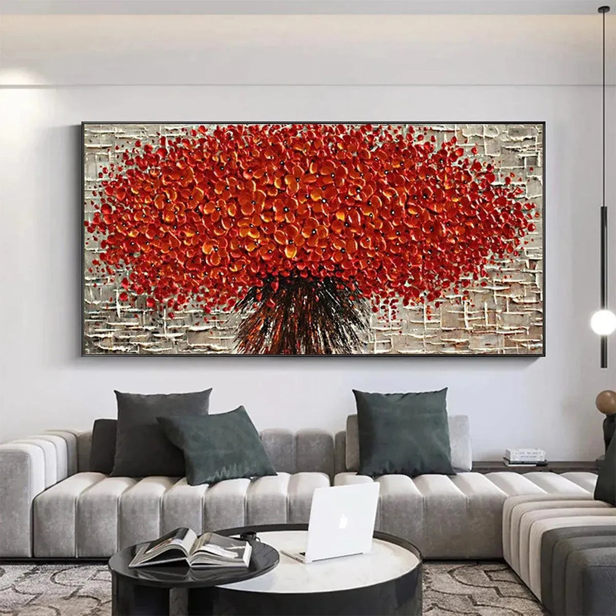 Crimson Burst textured impasto red floral painting by Isabella Rossi in black frame above modern gray sectional sofa.