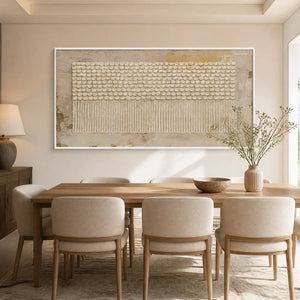 Neutral textured panoramic wall art with raised dot pattern in a white frame displayed in a refined dining room.