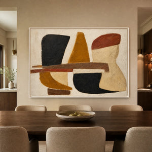 Earth tone abstract wall art with bold organic shapes in black, ochre, rust, and beige displayed in a refined dining room.