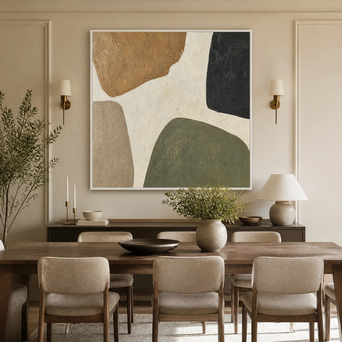 Organic neutral abstract wall art with earthy shapes in a white frame displayed in a refined dining room.