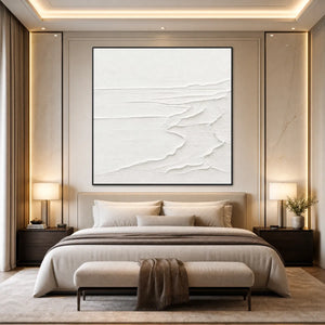 Minimalist white textured seascape wall art above a neutral bed
