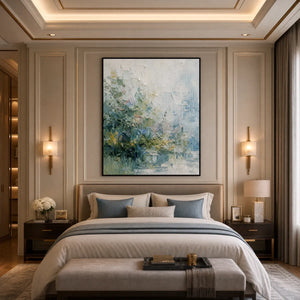 Heavily textured abstract floral garden painting in soft green and blue tones above a luxury bed