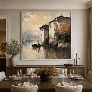 Fogbound Canal original oil painting of a misty European waterside cityscape in a white frame displayed in a refined dining room.
