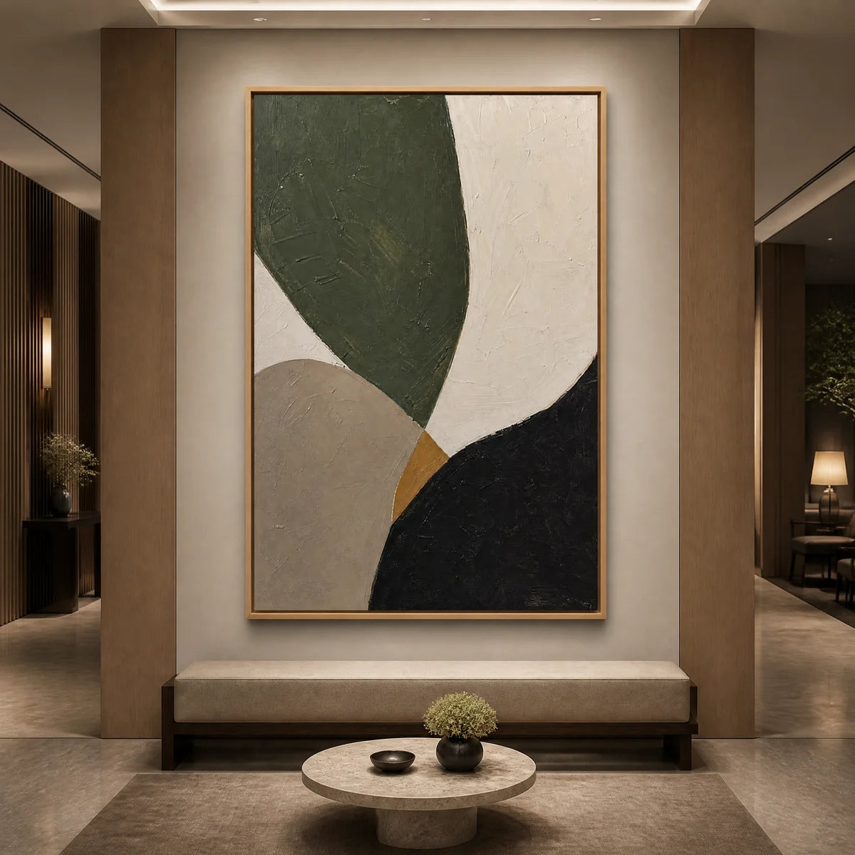 Modern organic abstract wall art with green, beige, black and white shapes in a gold frame displayed in a luxury hotel lobby.