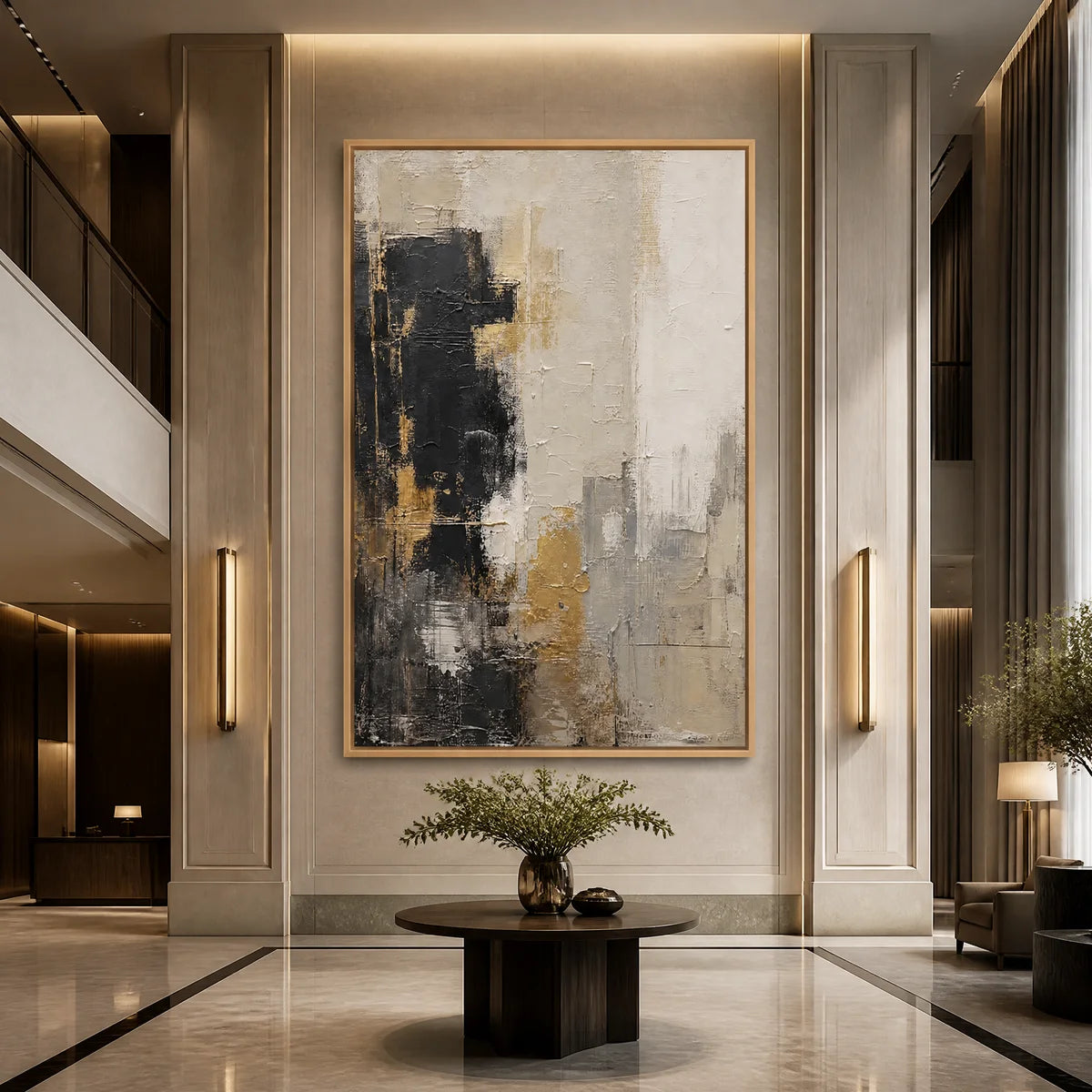 Black white gold abstract wall art in a wood frame displayed in a luxury hotel lobby.