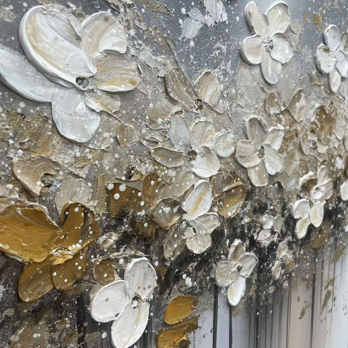 Golden Drift abstract: close-up of 3D impasto white & gold floral textures on gray.