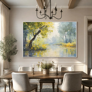 Modern impressionist oil painting of lakeside trees with heavy impasto brushstrokes, set in a clean white frame, showcased in a bright and elegant dining room interior.