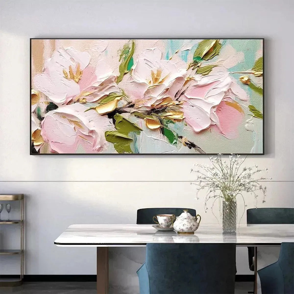 Golden Blush impasto painting with textured pink flowers, gold accents, and green leaves, displayed above a dining table.