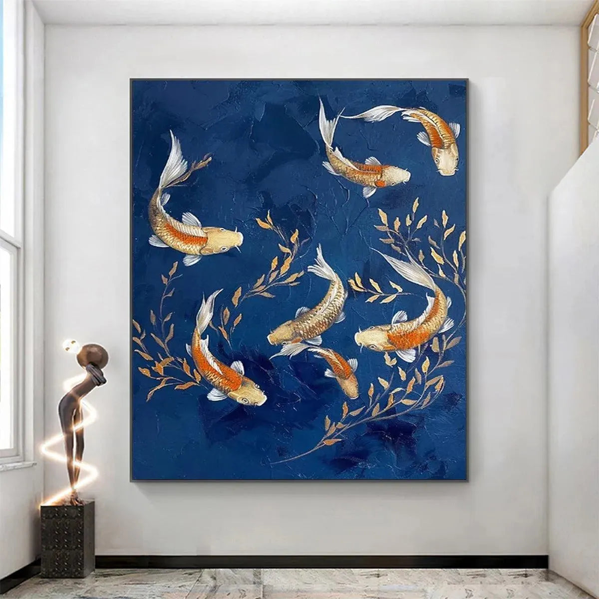 Vertical Golden Koi painting on deep blue, showcasing its scale and beauty in a bright, modern home interior.