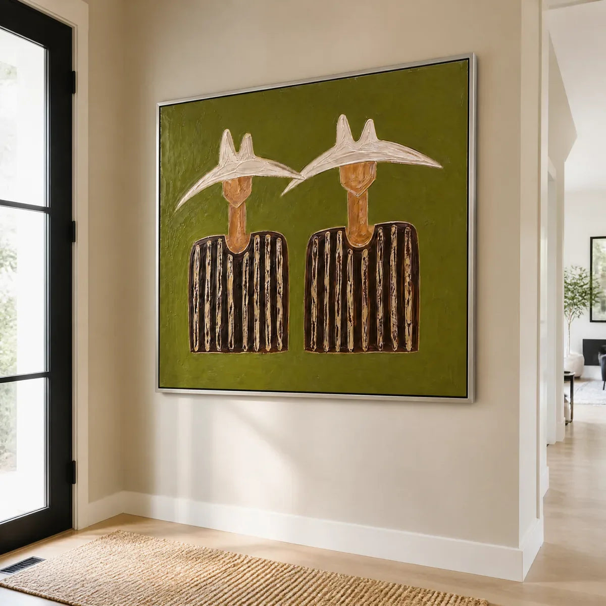 TWIN SOLSTICE FIGURES displayed in a refined entry hall