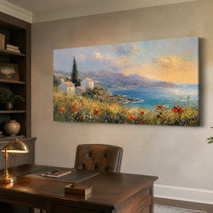 Textured canvas art of a Mediterranean seaside village, hanging above a professional home office desk.