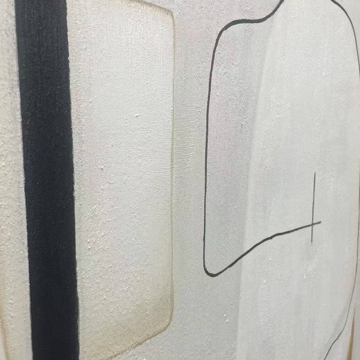 Neutral abstract painting detail, featuring a bold black stripe and black line art on textured white canvas.