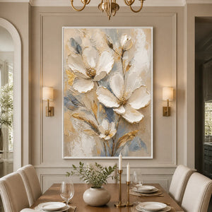 White magnolia floral wall art with gold accents displayed in a refined dining room.