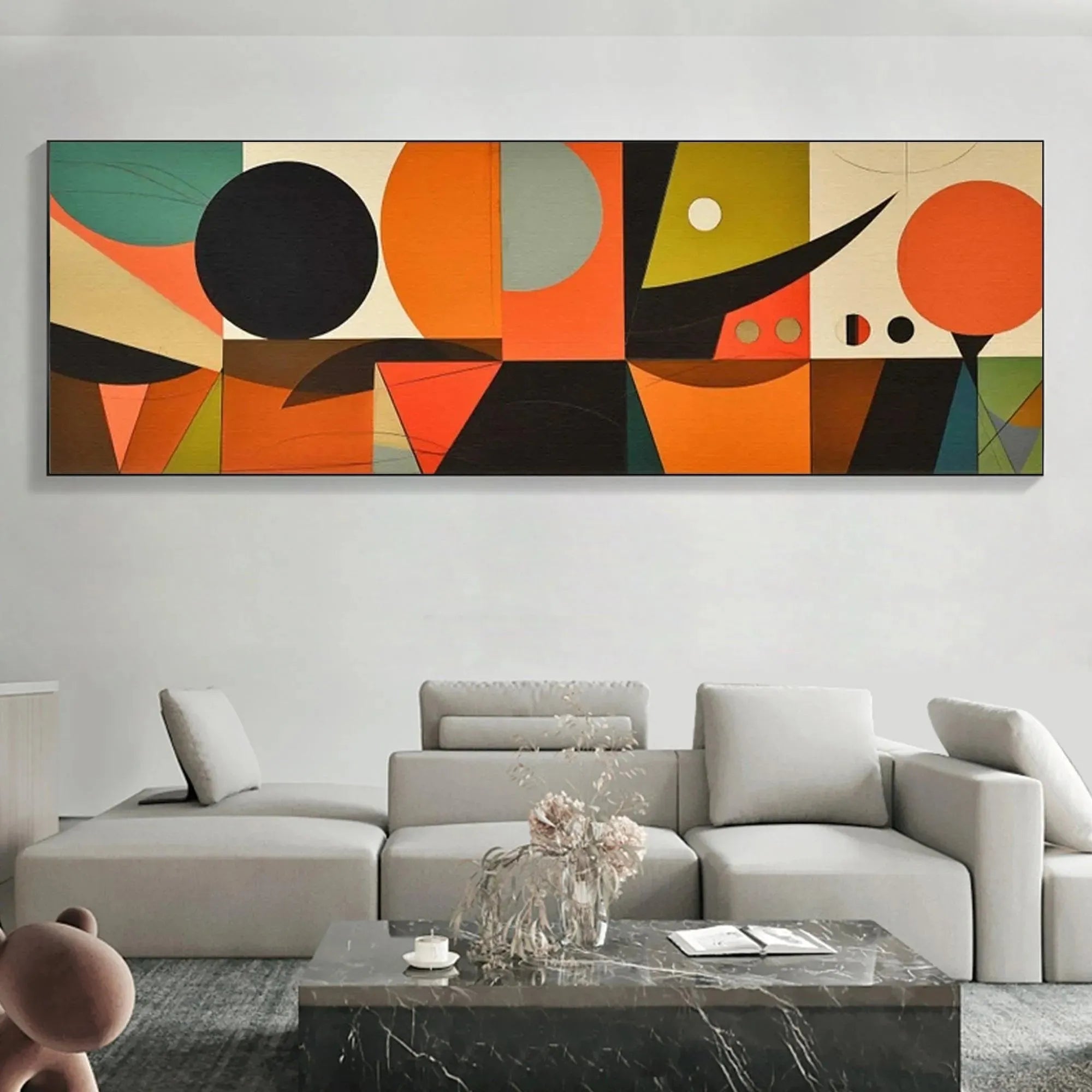 Panoramic mid-century abstract painting: orange, black, cream, green geometric shapes above sofa.