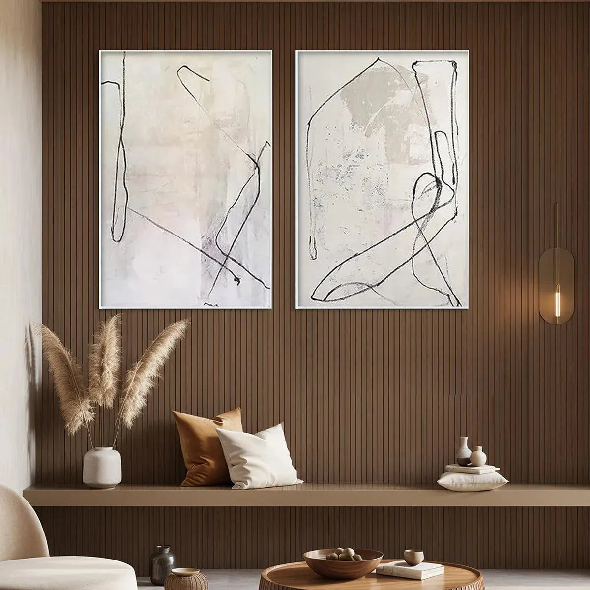Javier Ramirez minimalist diptych set of 2 beige abstract paintings with organic black line art, styled in living room