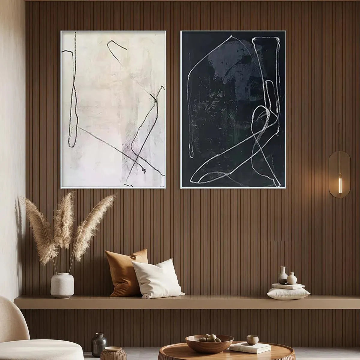 Minimalist Abstract Duo: Black & white abstract art set in metallic frames, styled in a living room.