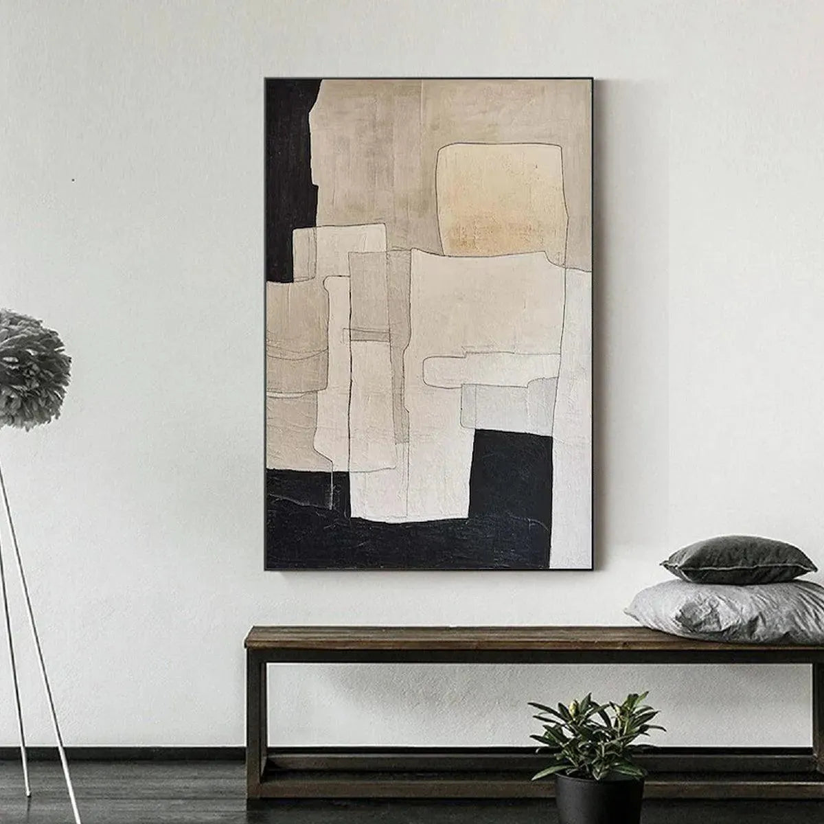 Javier Ramirez vertical abstract painting with beige, cream, and black geometric shapes in a modern room setting.